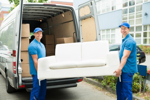 Removal team handling household items in Brixton