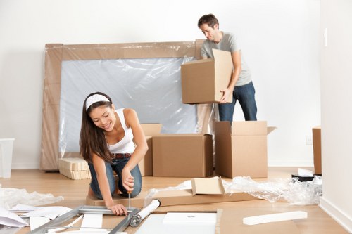 House removalists in Brixton loading moving boxes into a van