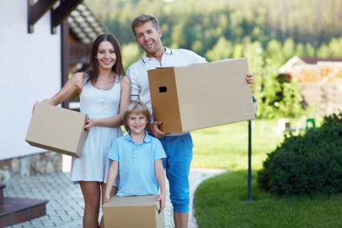 Packed moving boxes and furniture prepared for removal services in Brixton
