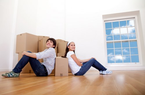 Packed furniture and boxes inside a Brixton removal van