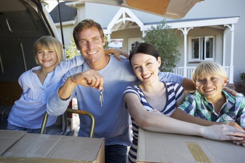 Professional movers transporting office items in Brixton