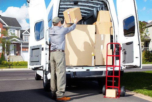 Removal team handling furniture carefully during transport