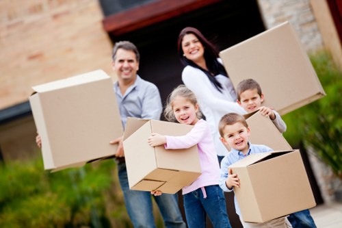 Packed moving boxes and furniture ready for transport in Brixton home move
