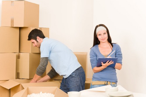 Local removals team planning a move in Brixton with boxes and equipment