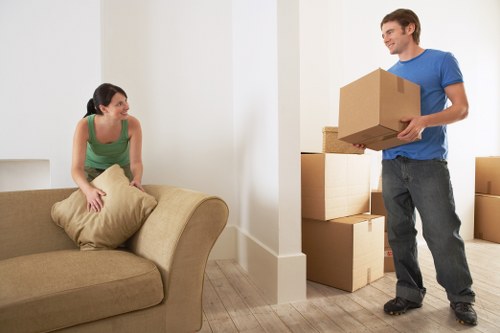 Local removals team navigating a Brixton street with residential properties